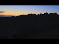 Bighorn Sheep and a human couple watching the Sunset at South Dakota Badlands