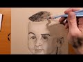 Drawing a portrait in charcoal.