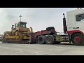 Caterpillar 320 excavator and D9r dozer loading on the trailer and lashing and ready to transport.