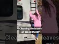 CLEANING THE TOP OF THE RV.