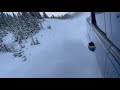 Driving fast on snow in the mountains.