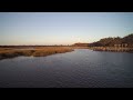 Sunset flight over salt marsh (4K)