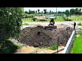 clearing water in the fence a 17-meter-long to buid bank.by mini-dozer D20 and truck in processing