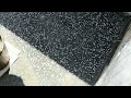 cara pasang batu kacang-batu sikat- batu pebble wash campuran warna hitam dan putih di kolam renang