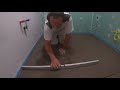 Lay the bathroom screed and tile the floor + drill the core hole