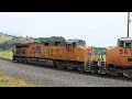 Long Union Pacific loaded oil train coming down steep grade the Moffat Route