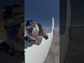 Man climbs on top of plane and rides till he flys off