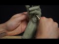 sculpting a hand in clay