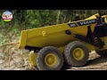 RC HUINA 594, VOLVO A40G, HUINA 593, HUINA 1573, TRUCK AND BOLDUZER POUR THE SOIL INTO THE WATER .