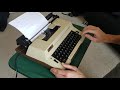 Typing on a vintage Montgomery Ward electric typewriter