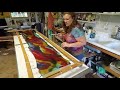 Hand painting a silk scarf.