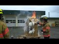 Salem firefighter demonstrates fire flow paths by burning down doll house