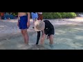 playing with a stingray at shallow beach