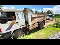 Pulling out a stuck dump truck near the railway By a driving expert and highly talented