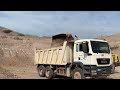 Komatsu and Caterpillar leveling the mountain excavator dozer motor grader wheel loader dump truck.