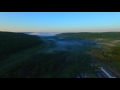Flight down foggy valley