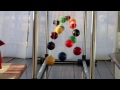 A simple demo of order and chaos (and order again) - Home made Pendulum Wave with 15 billiard balls