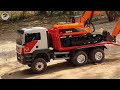 Bruder MAN TGS carries two Tractors and Long Arm Excavator