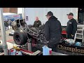 Champion Speed Shop Pit`s O/H from prior days run Attaching fuel supply to perform warmup