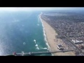 Flying over Huntington Beach Pier B-17 909