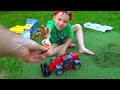 Alex Playing with POWER Wheels Tractors Trucks