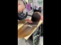 super long hair cut off on chopping board