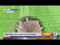 Massive sinkhole swallows soccer fields, light pole