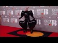 Stan Twitter: Sam Smith at 2023 Brit Awards walking on rests carpet w/ squid sounds