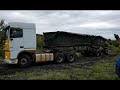 Toyota Landcruiser tows stuck in the mud 34 ton truck and trailer uphill