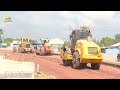 Great new road construction site with lots of construction vehicles on the busy road building site