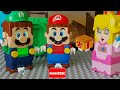 Lego Mario and Luigi enter the Nintendo Switch to save Peach. Baby Bowser is also waiting for them