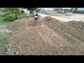 Wonderful New Initiative! Using dump truck and a bulldozer while pushing soil, filling it in