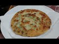 Scones in a pan of flour, water and green onions!