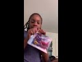 Cy’nia showing her lipgloss kit