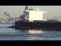 Foss Tugs Push Out Bulk Ship in Elliott Bay