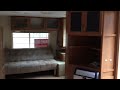 Tiny house with loft built from a travel trailer