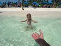 Toddler getting brave at the beach