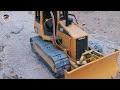 RC Bruder MAN TGS carries bulldozer, Bulldozer push the dirt