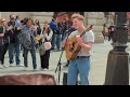 Street Busker in Piccadilly Circus. playing Yellow, Chris Martin- Coldplay