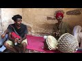 A Rajasthani Folk singer trying Malayalam Song, Kuttanadan punjayile.
