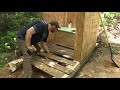 Building an outhouse at a remote off-grid wilderness camp