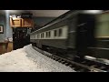 PRR centipedes AA units pulling NMRA 50th anniversary passenger cars with caboose.