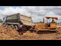 Extremely ! dump truck stuck in deep mud recovery by bulldozer ឡានដឹកដីជាប់ផុងជួយដោយអាប៉ុល