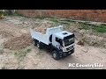 Two RC Hydraulic Dump Truck MAN TGS loading dirt to make new road to Warehouse