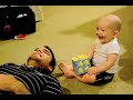 Baby laughing at Daddy sneezing