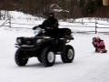 pulling kids on sled with polaris sportsman