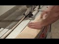 Ripping a straight edge on White Oak with sliding Table Saw with Safety hold down clamp.