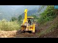 Tough Work-Rocky Mountain Road with JCB Backhoe