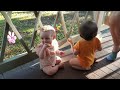 Hazel & Rowan eating snacks on the porch