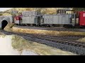 Grand Valley Layout depot run by with maximum length train.